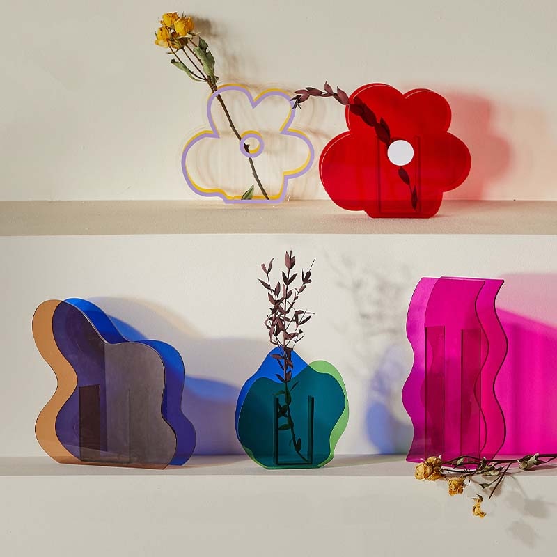 five Acrylic Flower Vases with a flower in different shapes 