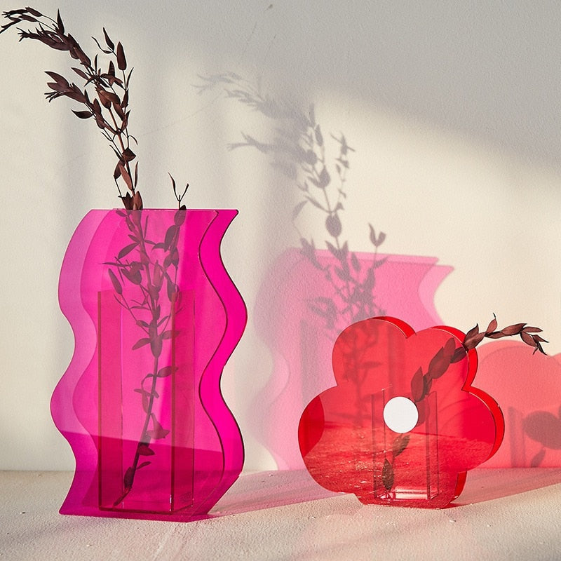 Pink and red  Acrylic Flower Vases with plant in it